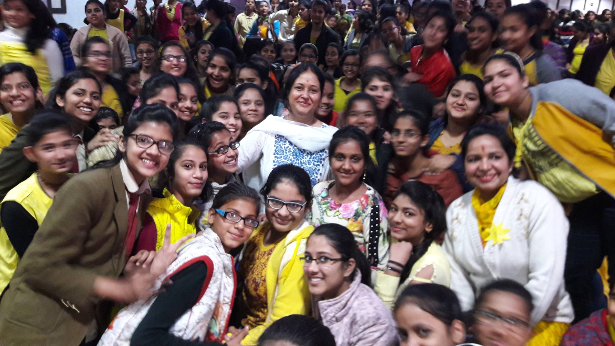 Women in a circle celebrating and learning together at Amodini Foundation workshop